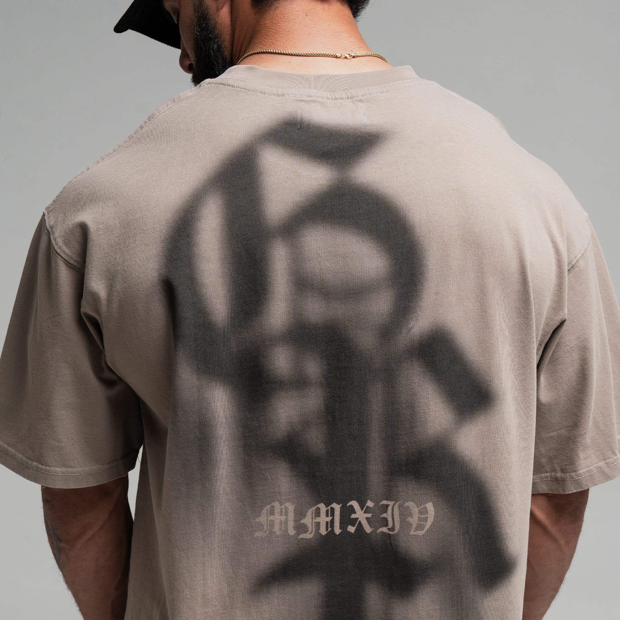 Athlete wearing GR Shadow Tee close up shot of back logo