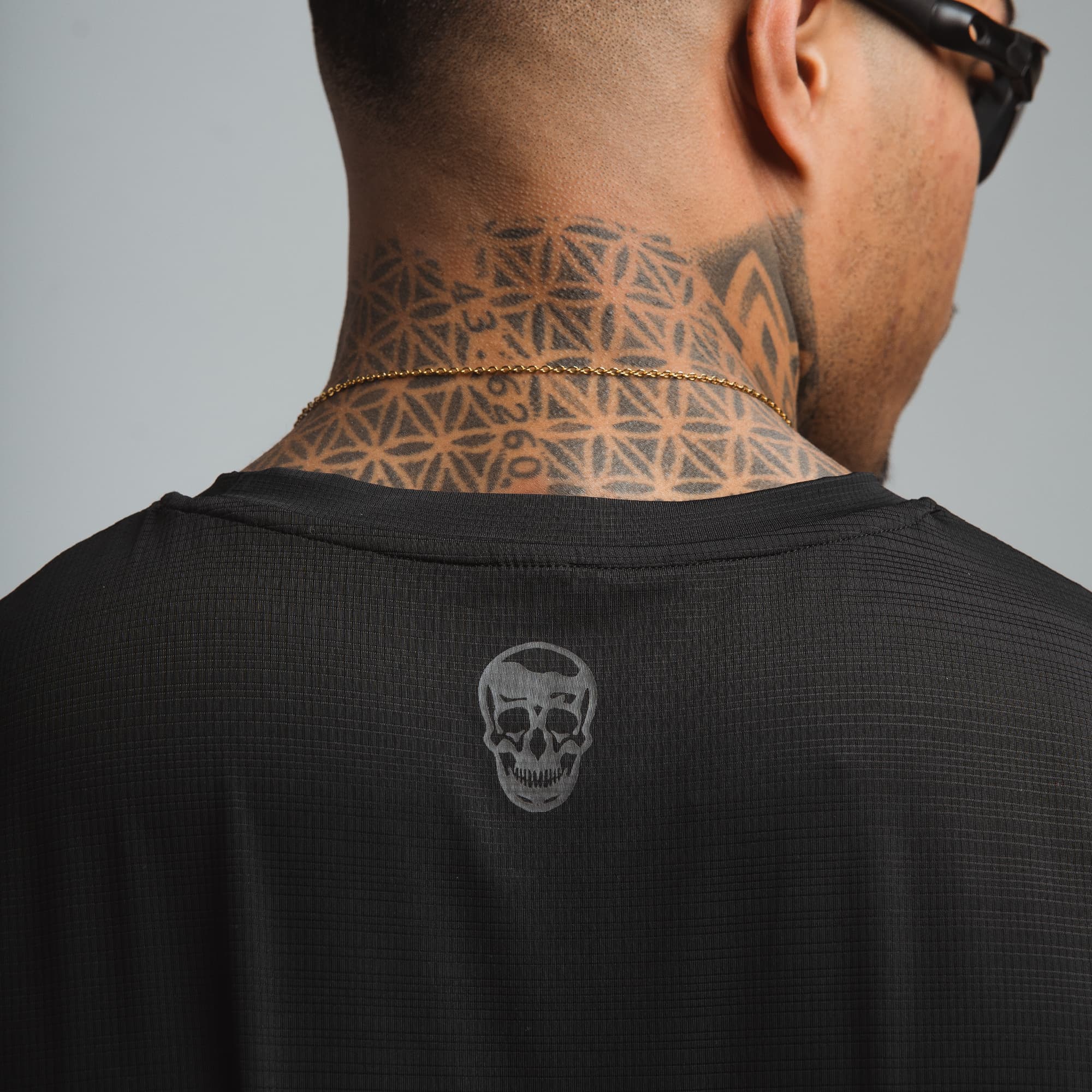 athlete wearing discipline division graphic tank detail shot of back graphic