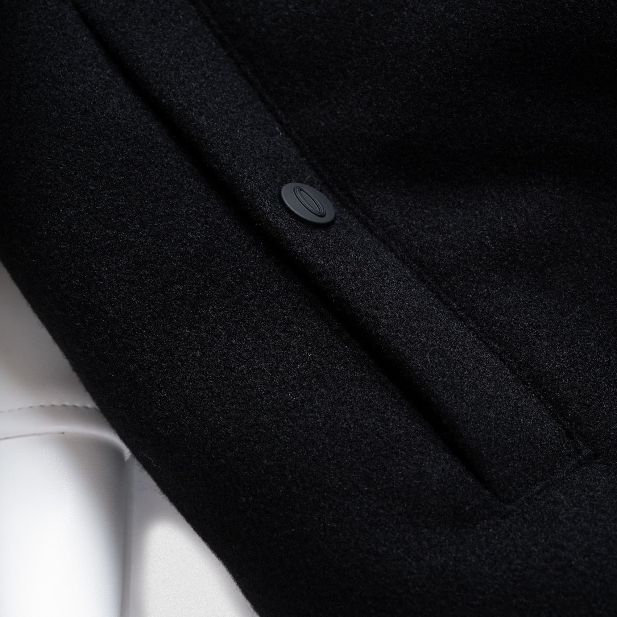close up detail shot of Olympia branded button