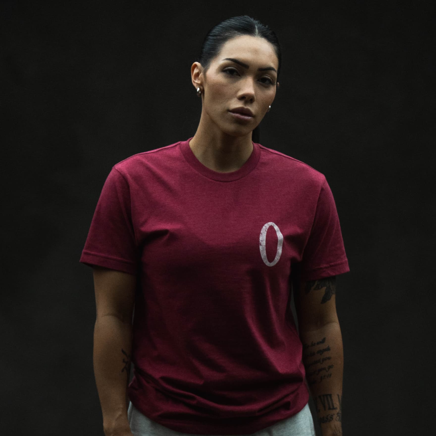 athlete wearing the olympia lifting club tee showcasing the front chest graphic