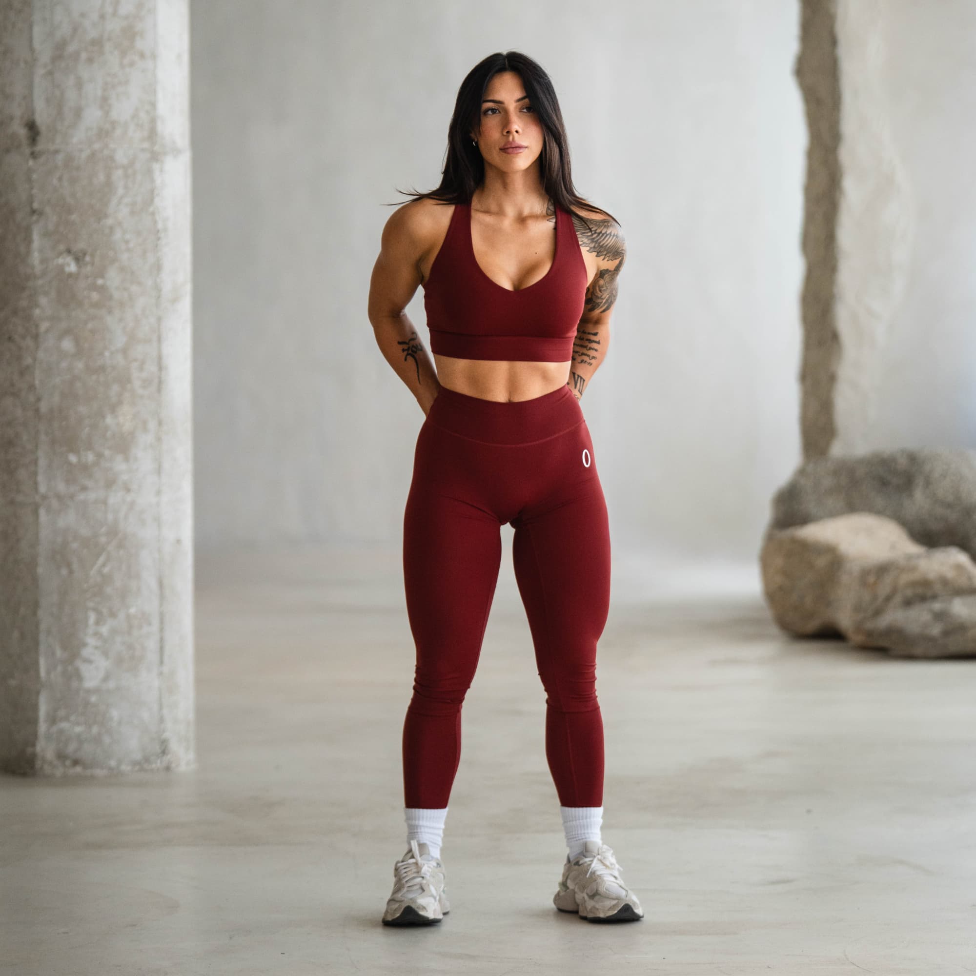 Full-body shot of model standing in Olympia Training Leggings and matching bra.