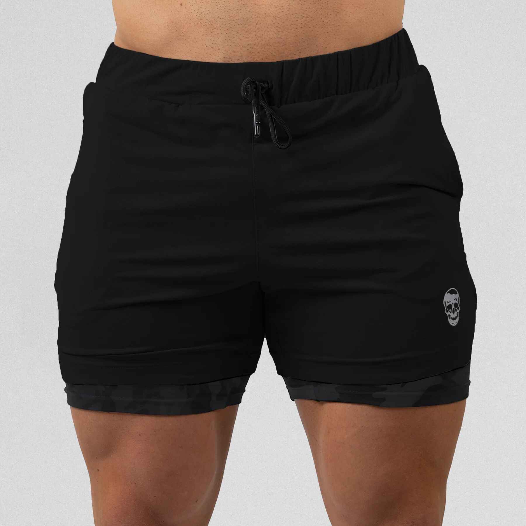 Gymreapers react training shorts black camo color way on athlete showcasing the front.
