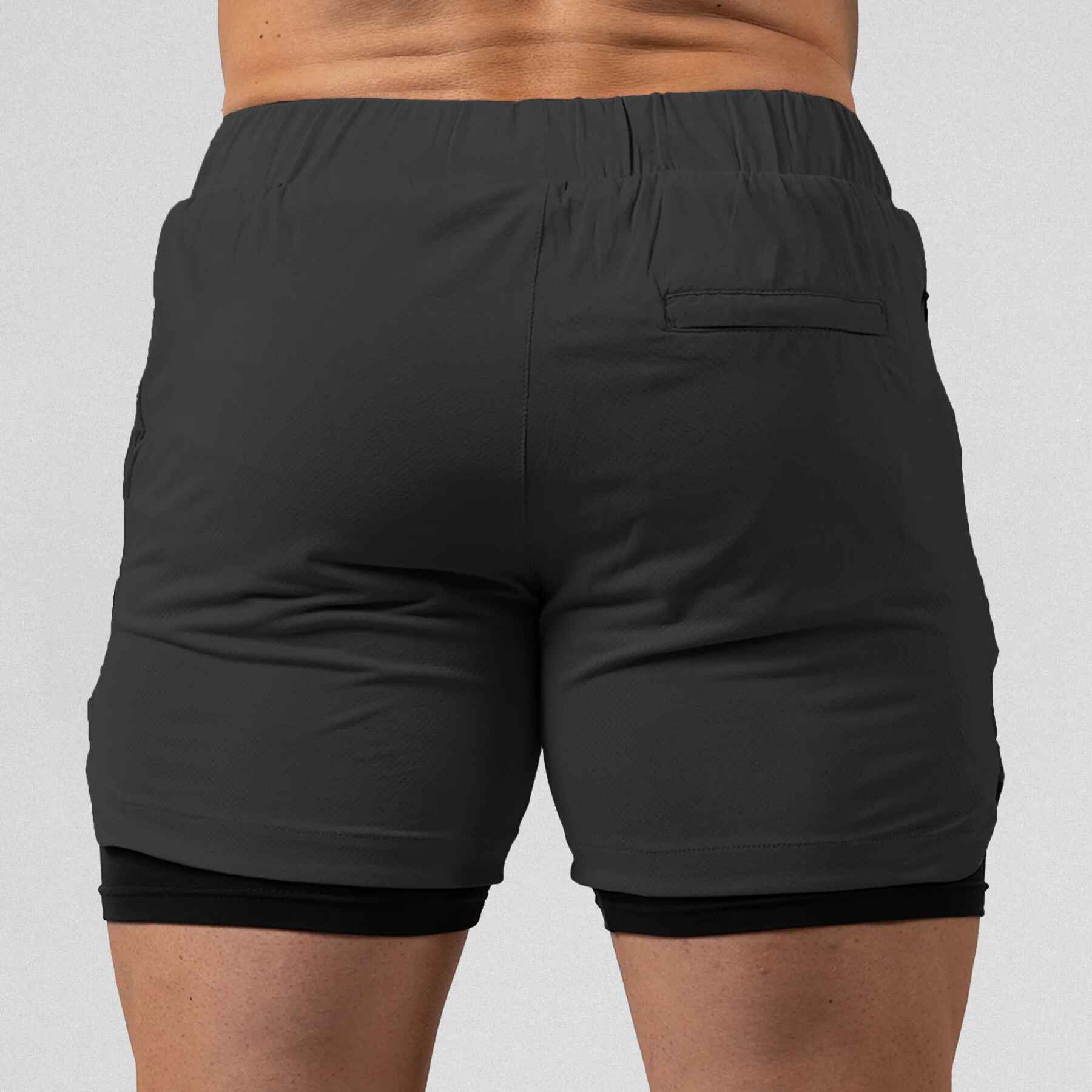 Gymreapers React training shorts gray color way on athlete showcasing the back of the shorts.
