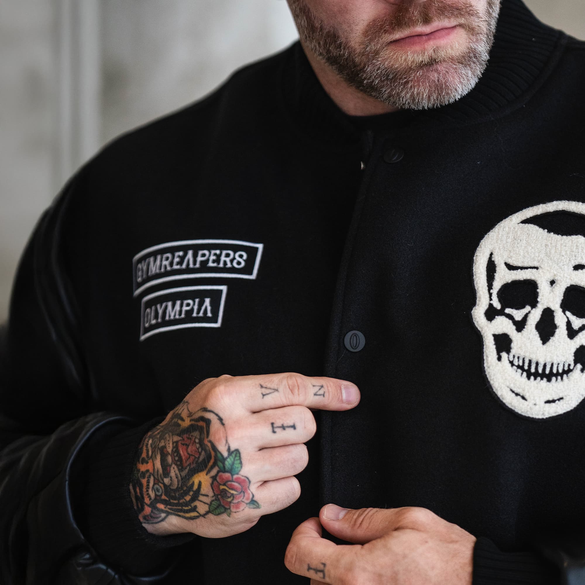 Close-up of Gymreapers x Olympia Varsity Jacket chest patches