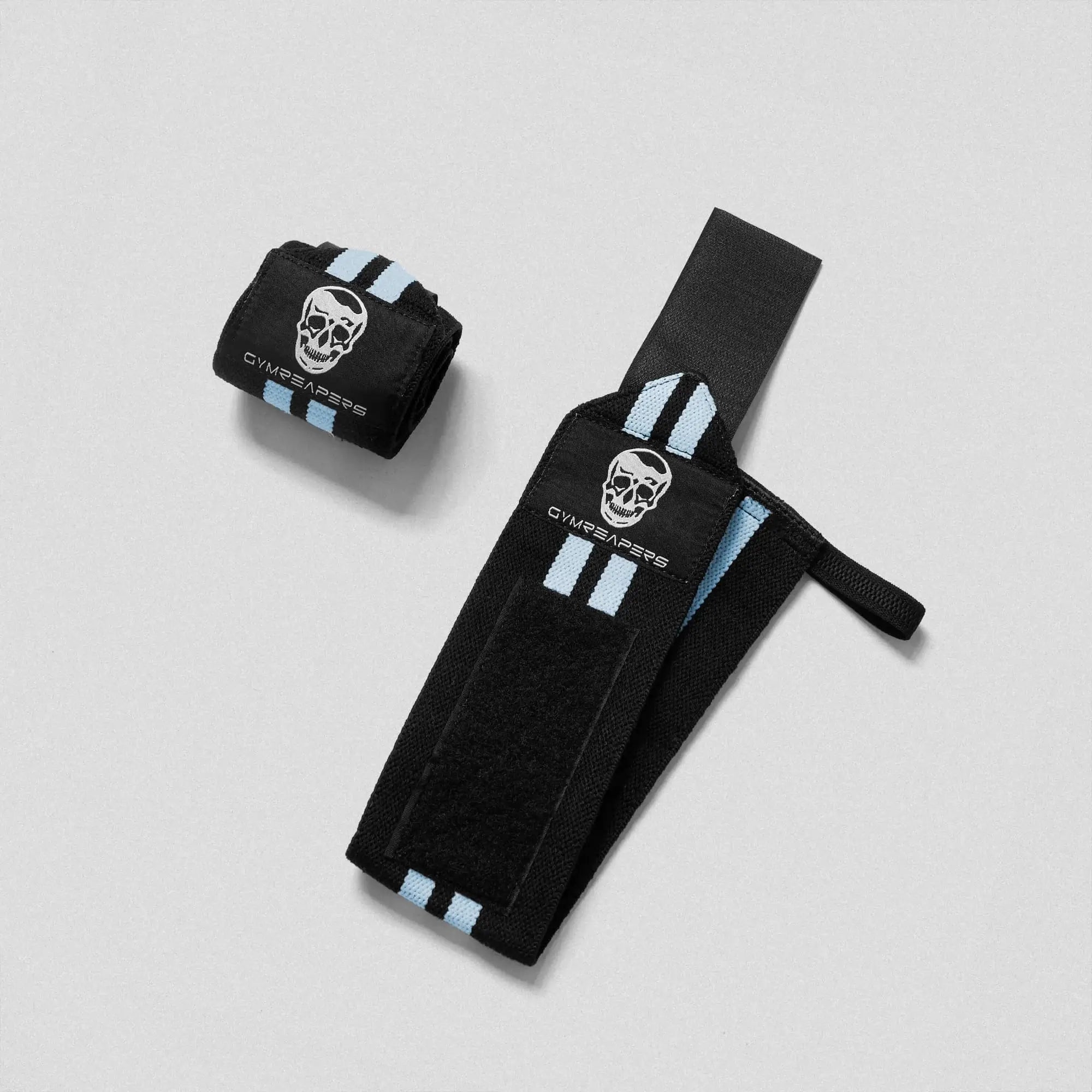 photo of black wrist wraps with blue accents. One flat opened and the other not