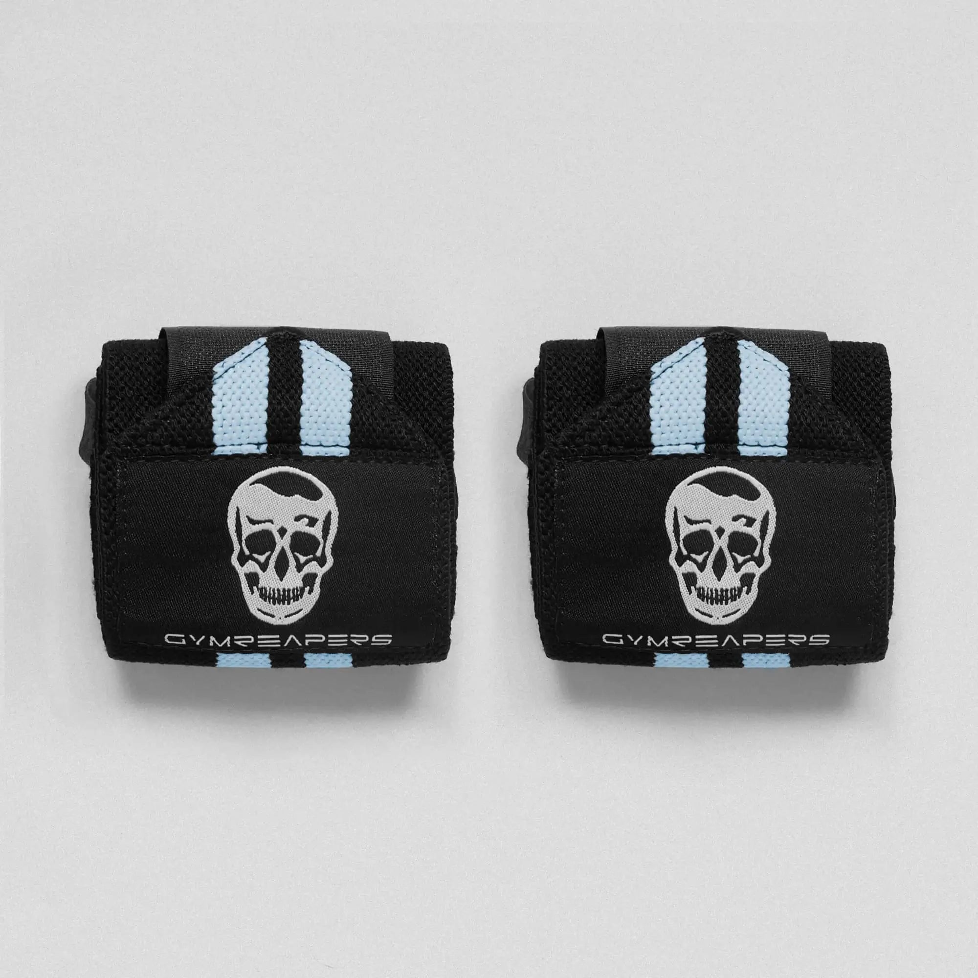 photo of black wrist wraps with blue accents side by side on gray background