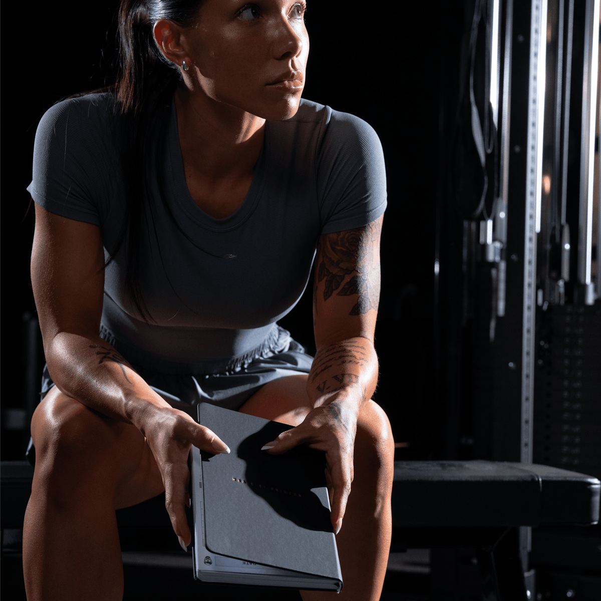 Women's Workout Journal in Black – Lifestyle, Sitting in Gym