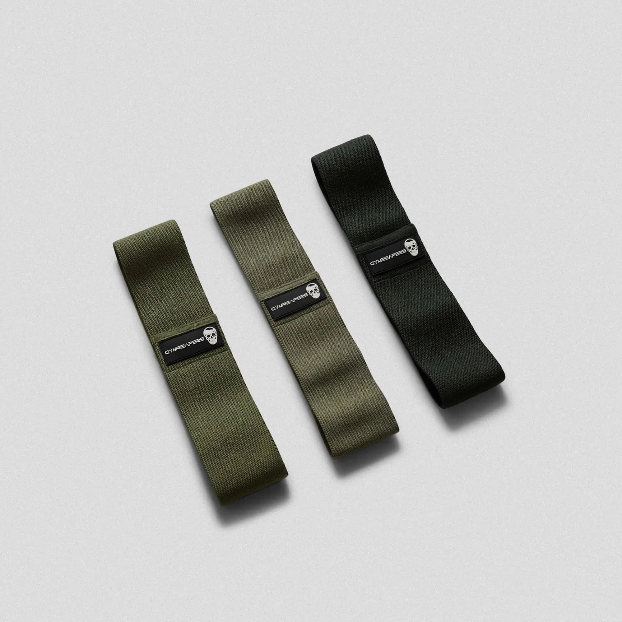 Photo of 3 pack military green hip bands side by side on gray background 