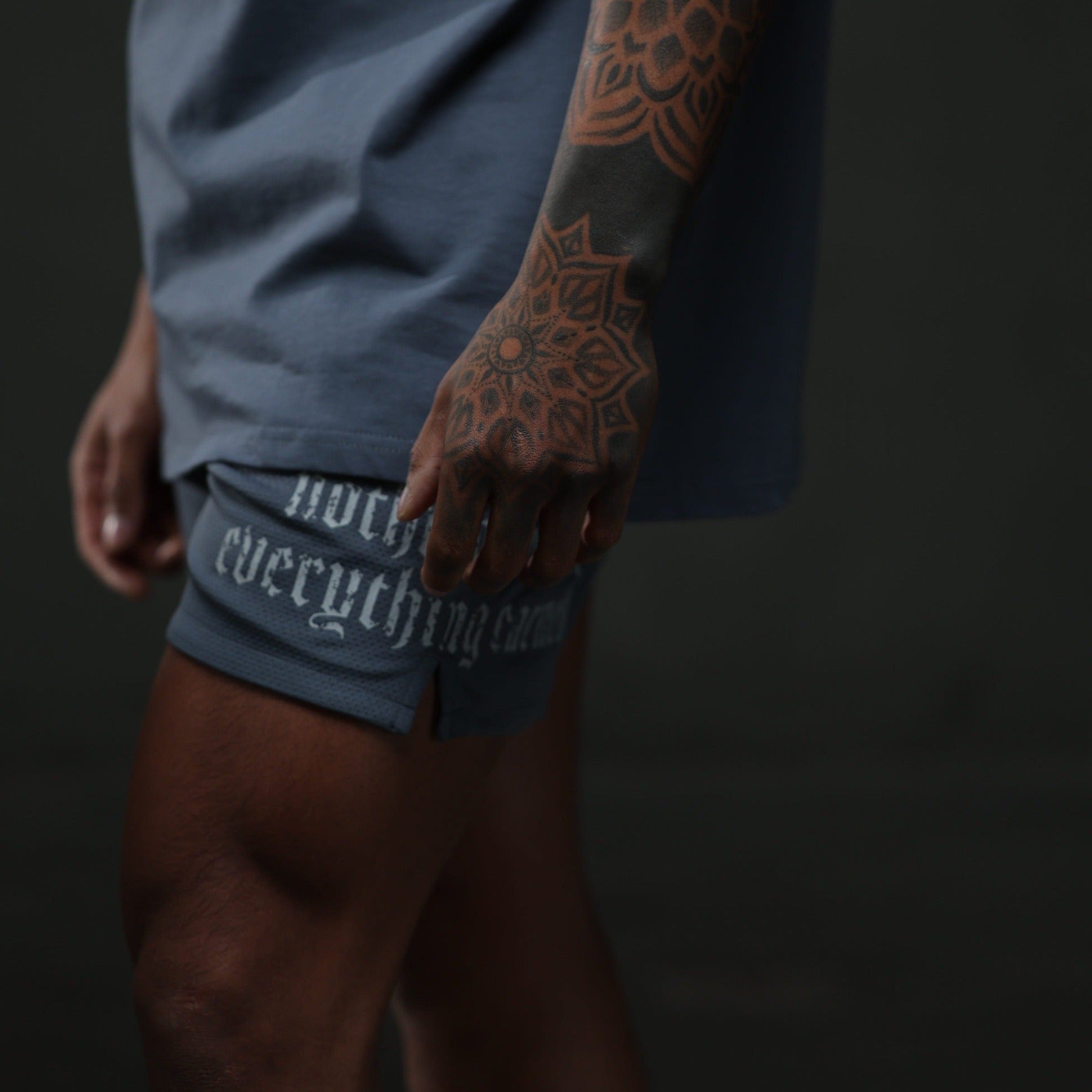 mantra shorts faded blue studio side