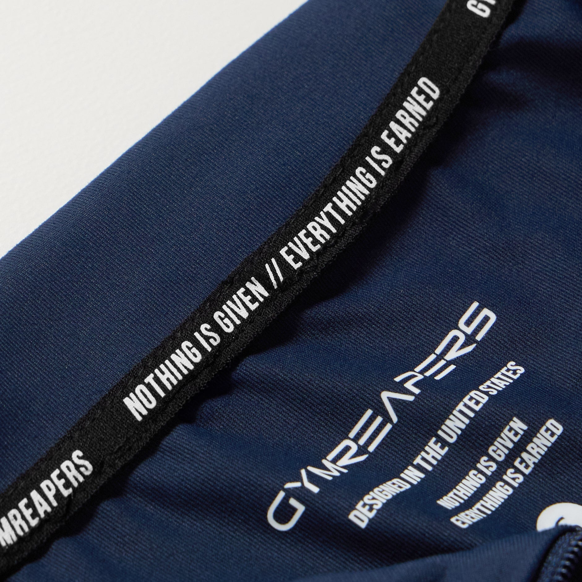 performance quarter zip navy tag