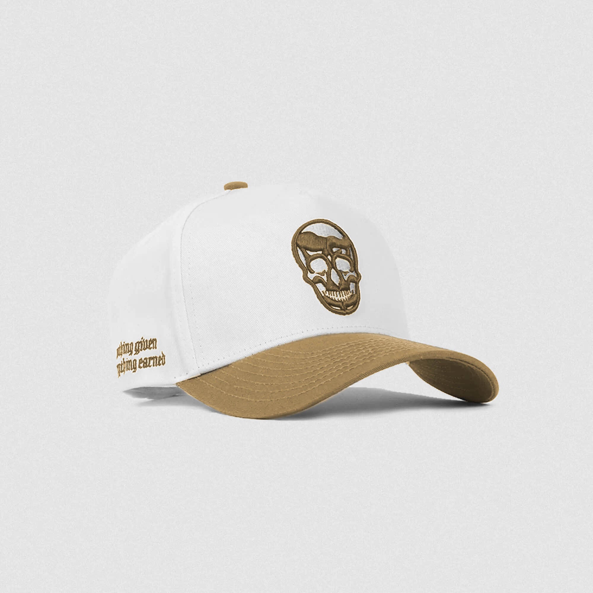 White and dark khaki 5-panel skull hat with tan embroidered logo and curved brim