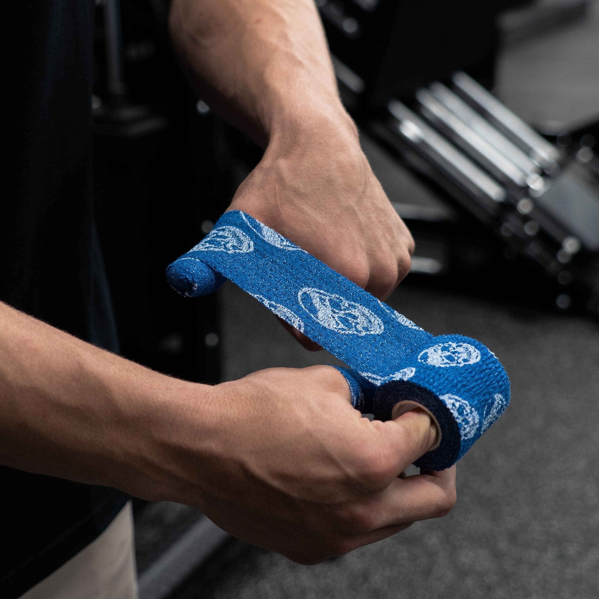 skull tape navy being wrapped on thumb